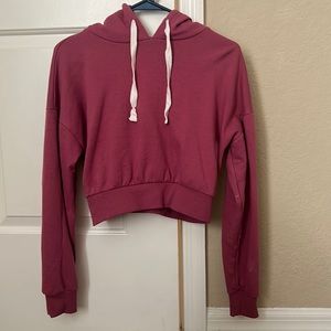 This is a pink cropped jacket